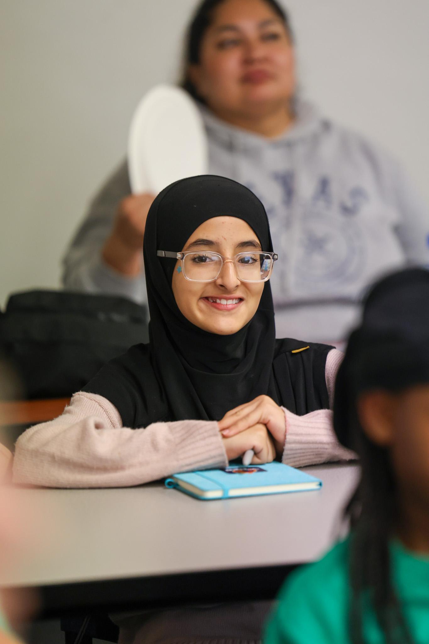 Student smiling at event