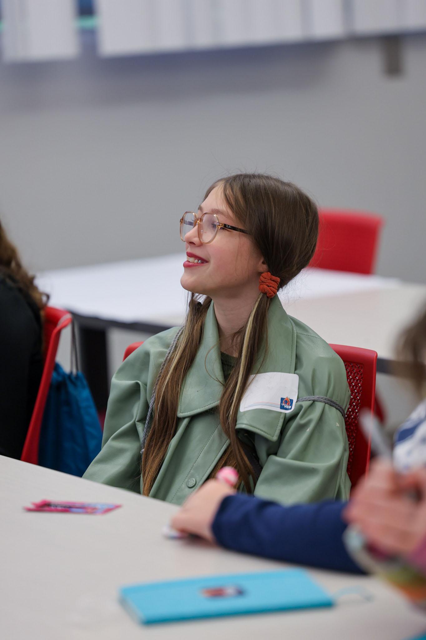 Student smiling at presenter